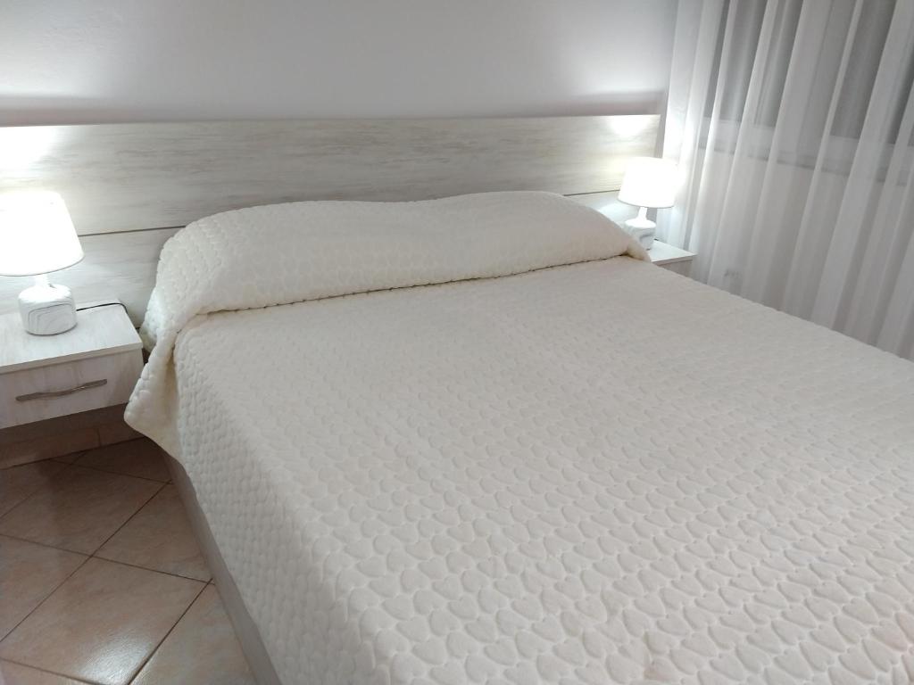 Postel nebo postele na pokoji v ubytování Sunset Apartment