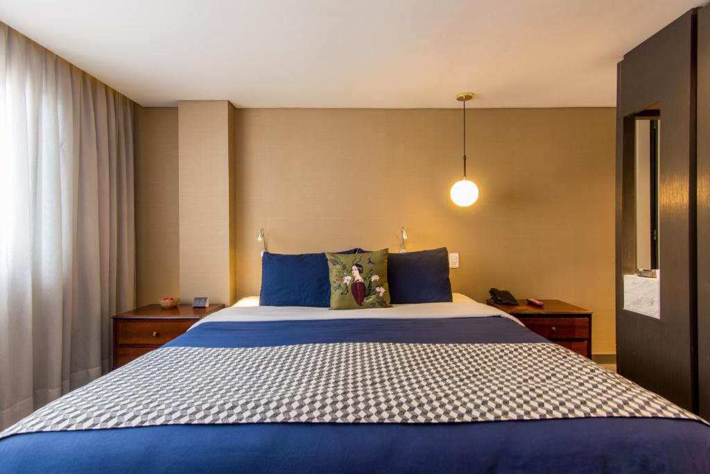 Postel nebo postele na pokoji v ubytování Hotel Regina