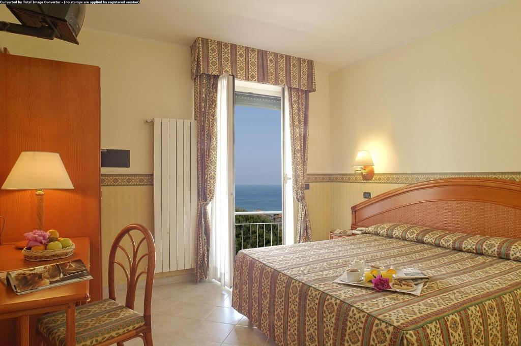 Posteľ alebo postele v izbe v ubytovaní Hotel Casella