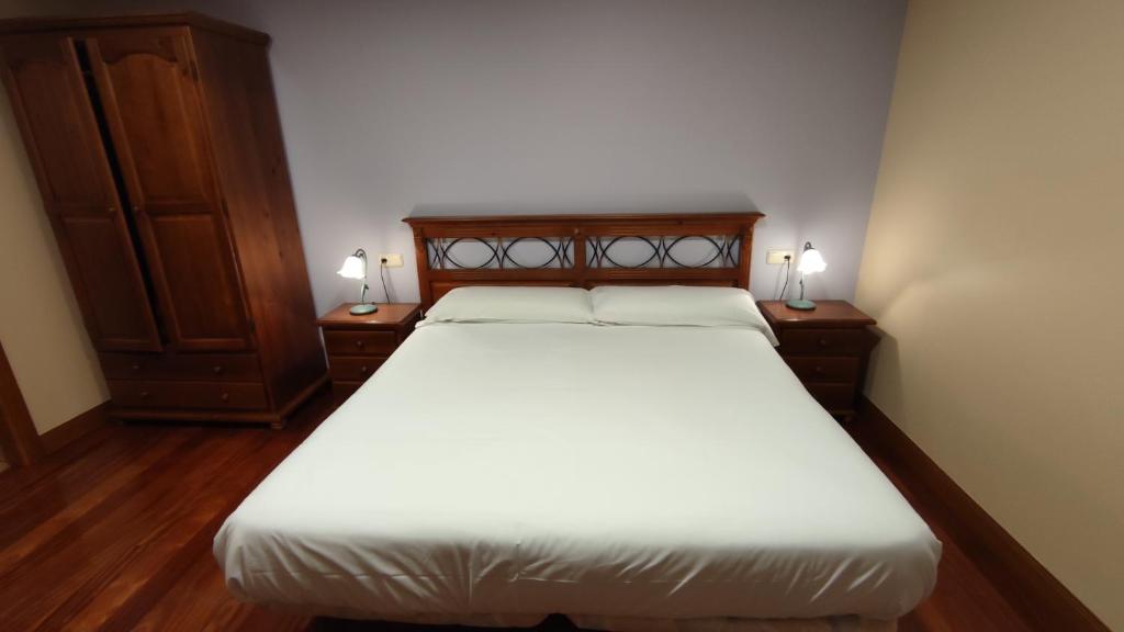 Postel nebo postele na pokoji v ubytování Ostatu Zegama