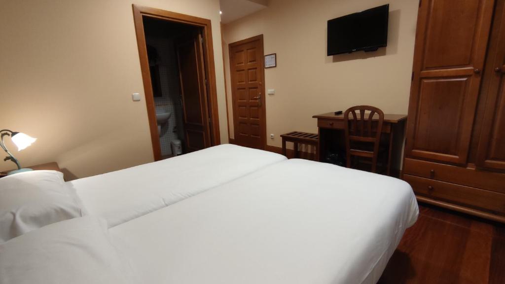 Postel nebo postele na pokoji v ubytování Ostatu Zegama