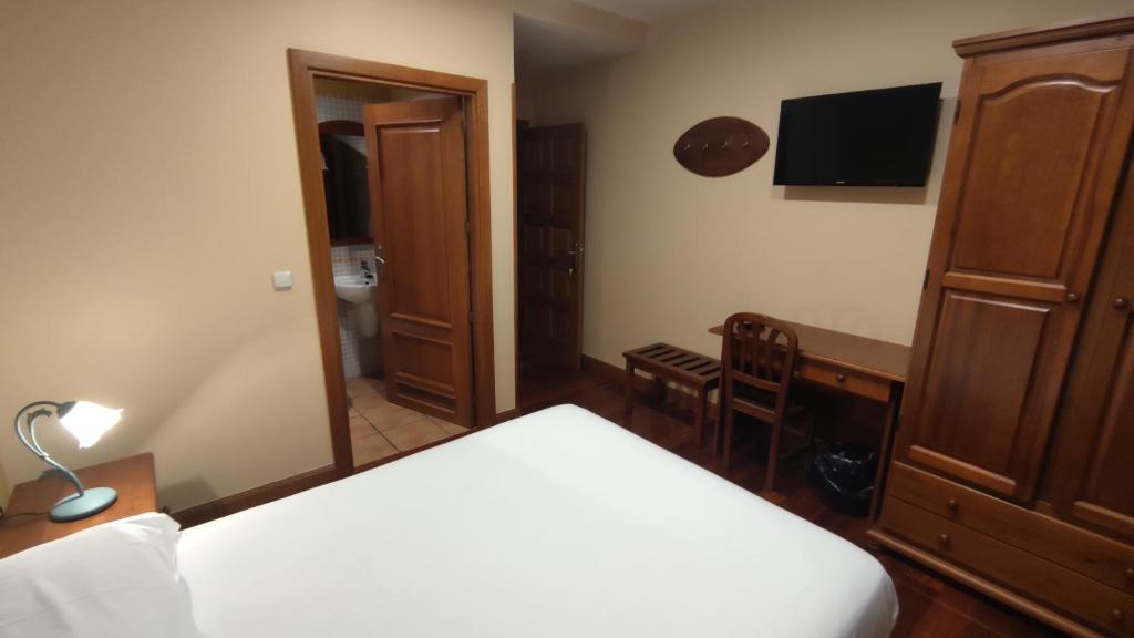 Postel nebo postele na pokoji v ubytování Ostatu Zegama