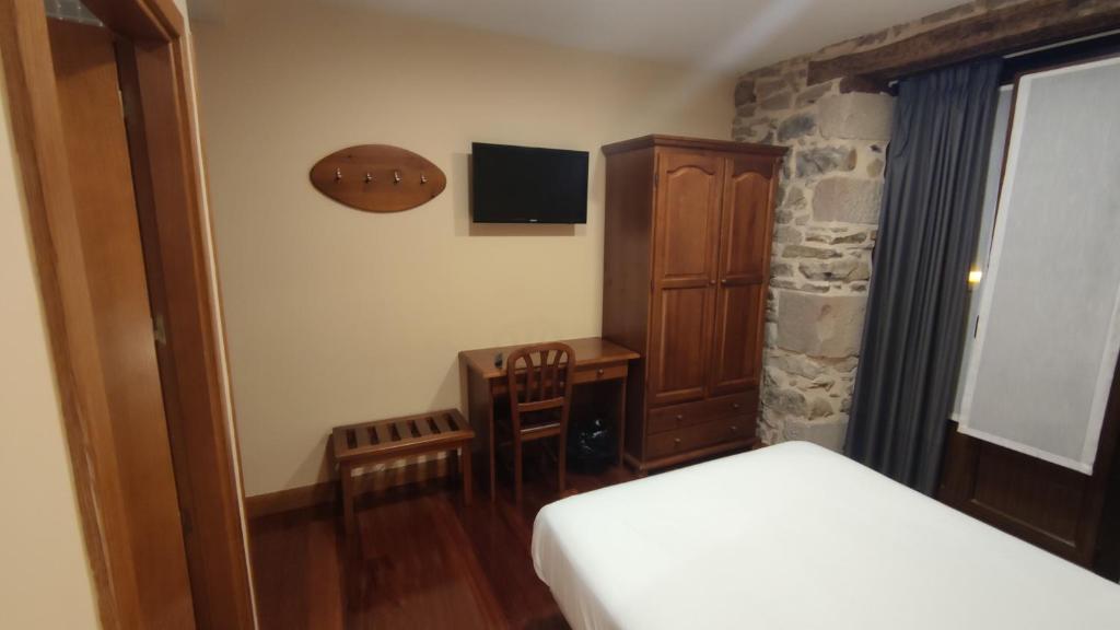 Postel nebo postele na pokoji v ubytování Ostatu Zegama