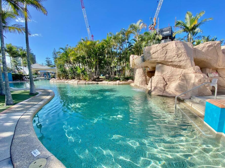 a pool in a resort with a water slide at Diamond Beach 35 in Gold Coast