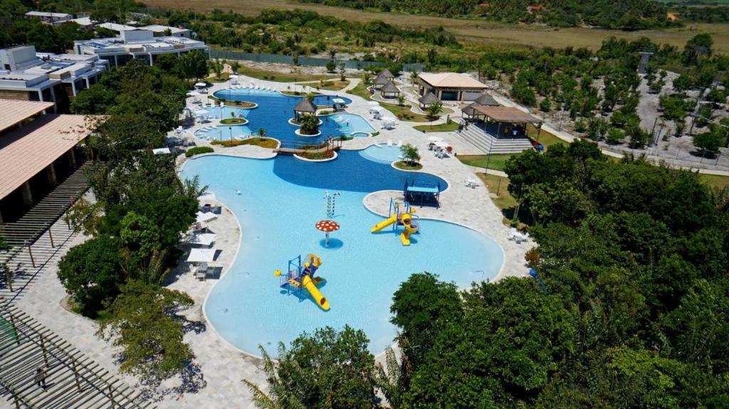 an aerial view of a water park with slides at ILOA Ap inteiro - 2 suites sala cozinha in Barra de São Miguel