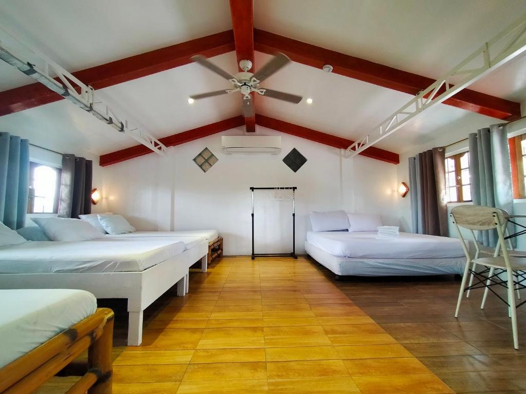 Postel nebo postele na pokoji v ubytování Balai Tinay Guesthouse