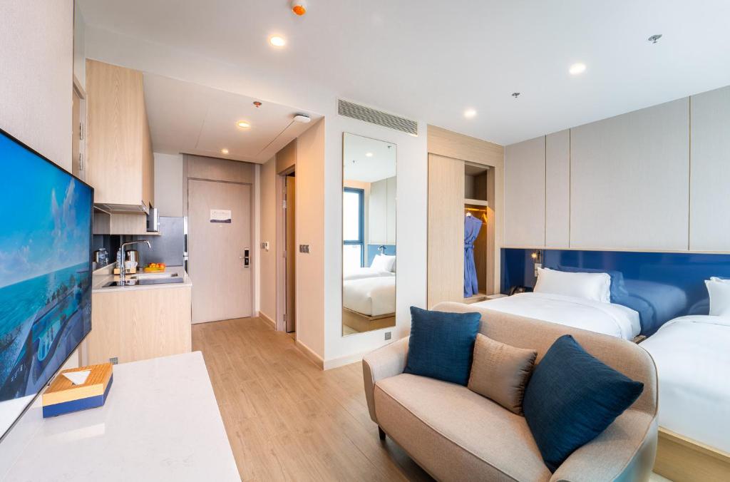 Postel nebo postele na pokoji v ubytování S Sriracha Hotel & Residence
