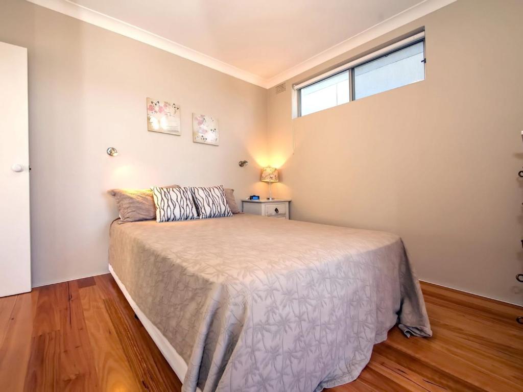 Postel nebo postele na pokoji v ubytování Bayview Towers Unit 1 15 Victoria Parade