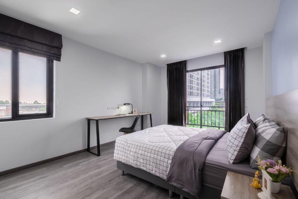 Postel nebo postele na pokoji v ubytování Aqua Residences อควา เรสซิเดนซ์ ห้องพักใหม่ให้เช่า ติดรถไฟฟ้าสถานีวุฒากาศ