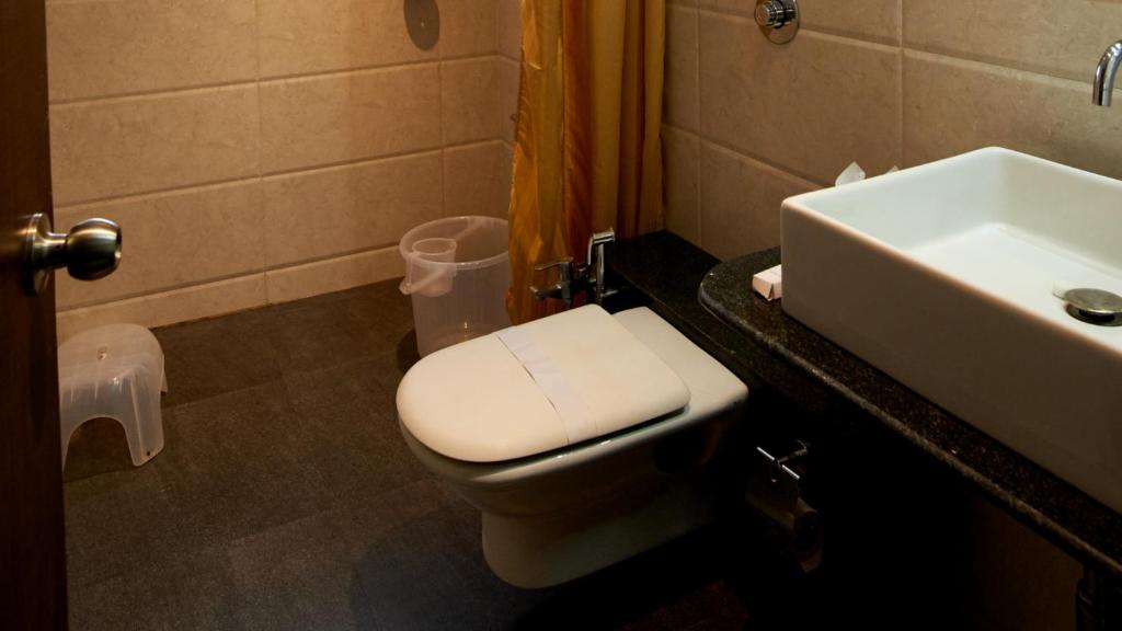 Koupelna v ubytování HOTEL SAI NISARG