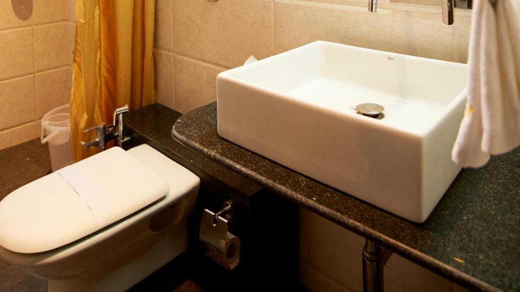Koupelna v ubytování HOTEL SAI NISARG
