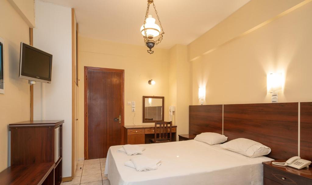 Postel nebo postele na pokoji v ubytování Lorenzo Hotel