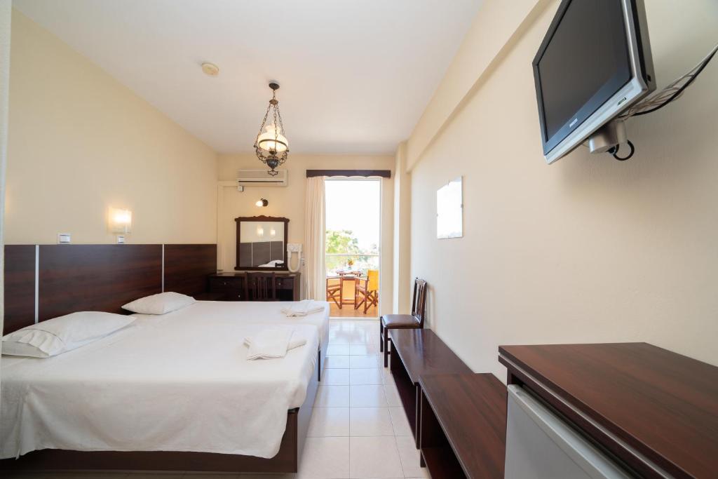 Postel nebo postele na pokoji v ubytování Lorenzo Hotel