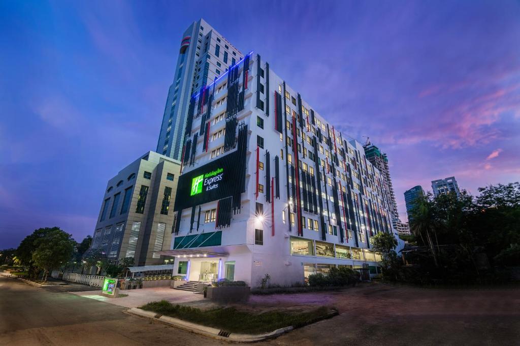 a tall building with a sign on the side of it at Holiday Inn Express & Suites Johor Bahru, an IHG Hotel in Johor Bahru