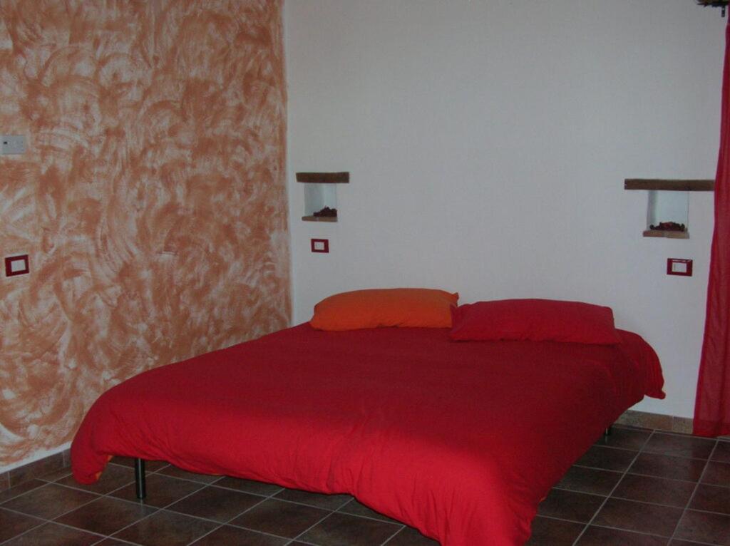 Posteľ alebo postele v izbe v ubytovaní B&B al Pozzolone