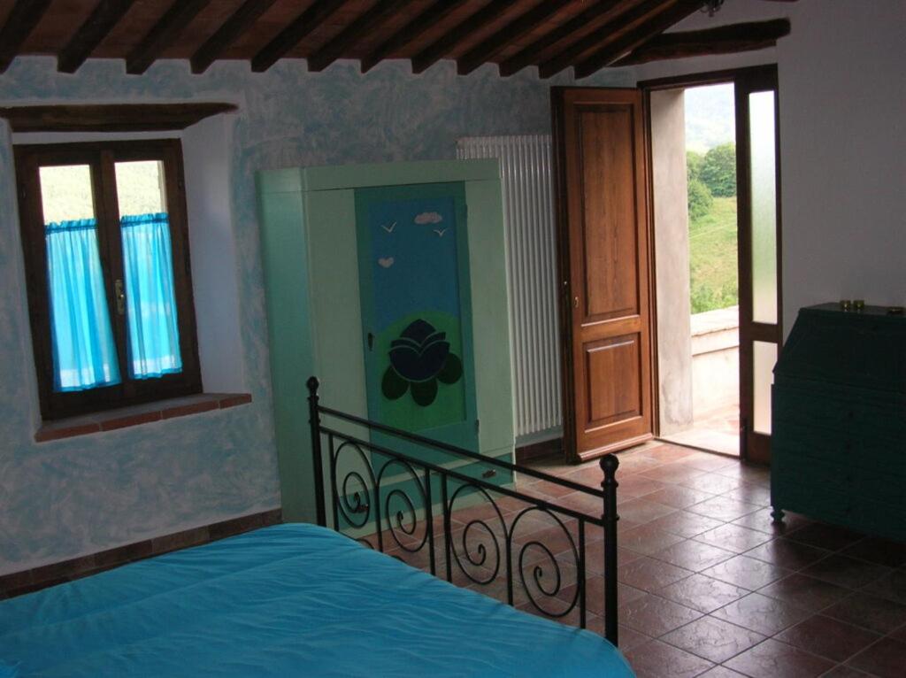 Posteľ alebo postele v izbe v ubytovaní B&B al Pozzolone