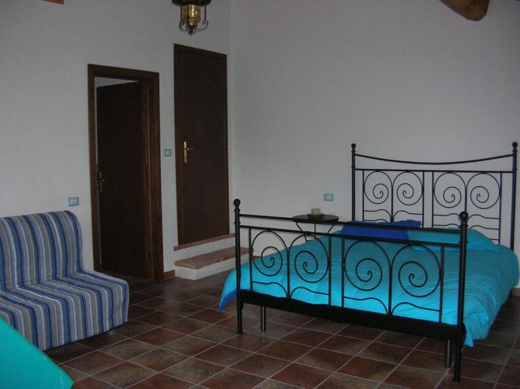 Posteľ alebo postele v izbe v ubytovaní B&B al Pozzolone