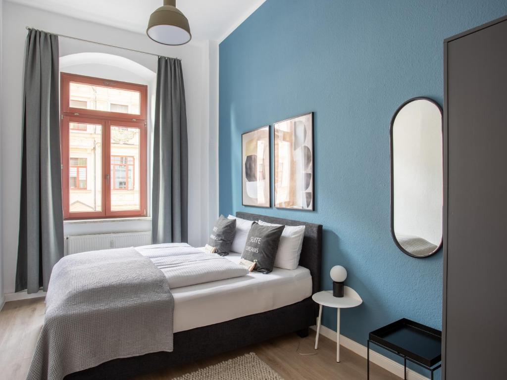 Postel nebo postele na pokoji v ubytování limehome Dresden Hoyerswerdaerstraße