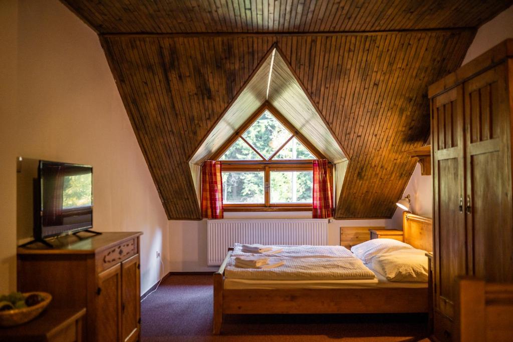 Postel nebo postele na pokoji v ubytování Penzion Panský dům