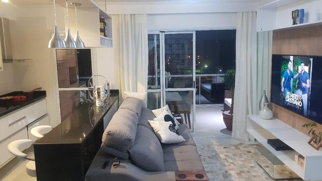 Televisyen dan/atau pusat hiburan di Apartamento Risort - Guarujá