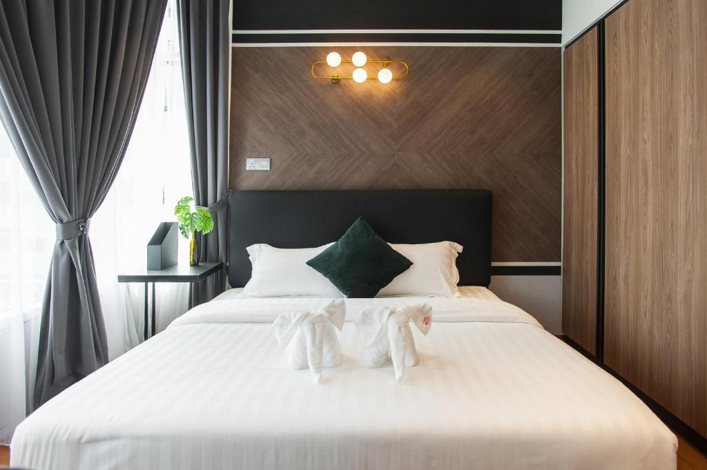 Ένα ή περισσότερα κρεβάτια σε δωμάτιο στο GH KLCC Apartment by GuestHouse