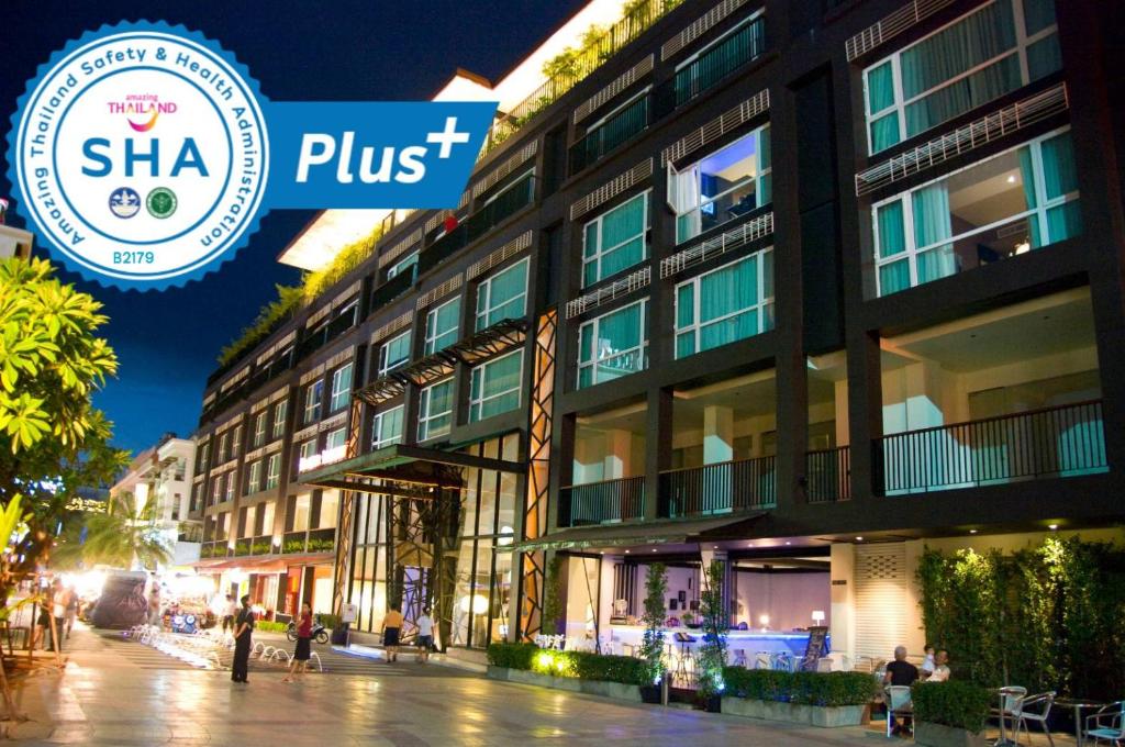 a building with a sign that reads shha plus at AYA Boutique Hotel Pattaya - SHA Plus in Pattaya