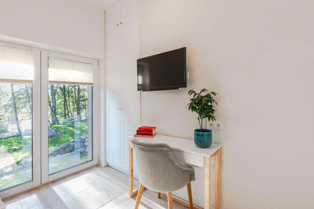 Televízia a/alebo spoločenská miestnosť v ubytovaní VacationClub – Szklarska Park VacationHome 1