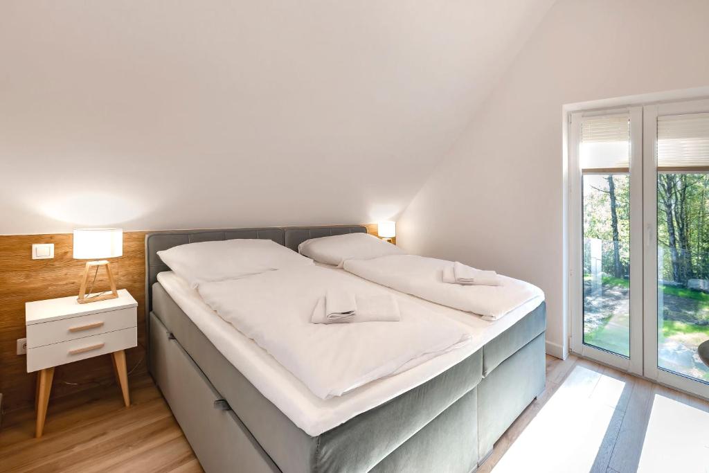 Posteľ alebo postele v izbe v ubytovaní VacationClub – Szklarska Park VacationHome 2