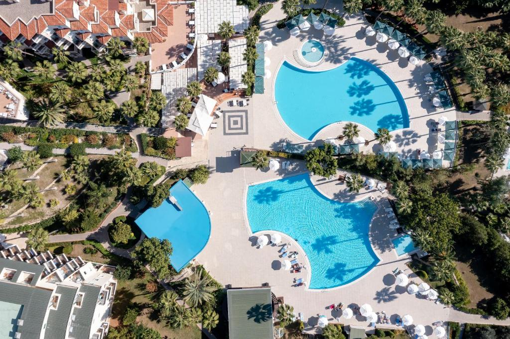an overhead view of a pool at a resort at Iz Flower Side Beach Hotel in Side