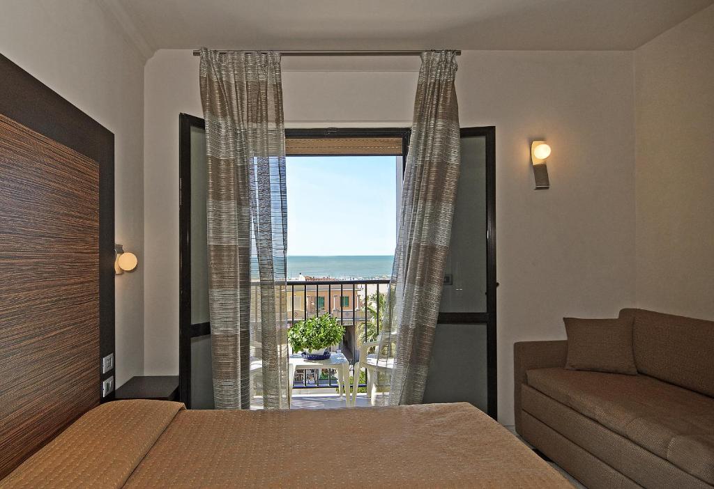 Postel nebo postele na pokoji v ubytování Hotel Eden