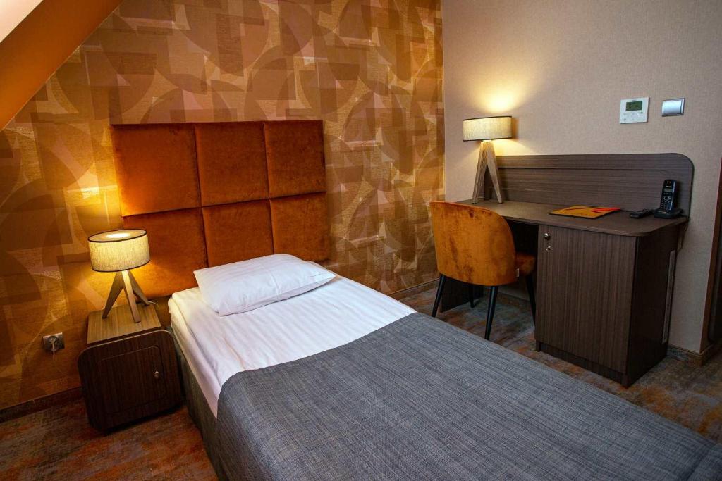Postel nebo postele na pokoji v ubytování Hotel Styl 70