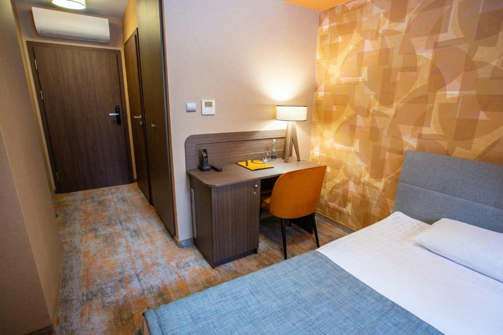 Postel nebo postele na pokoji v ubytování Hotel Styl 70