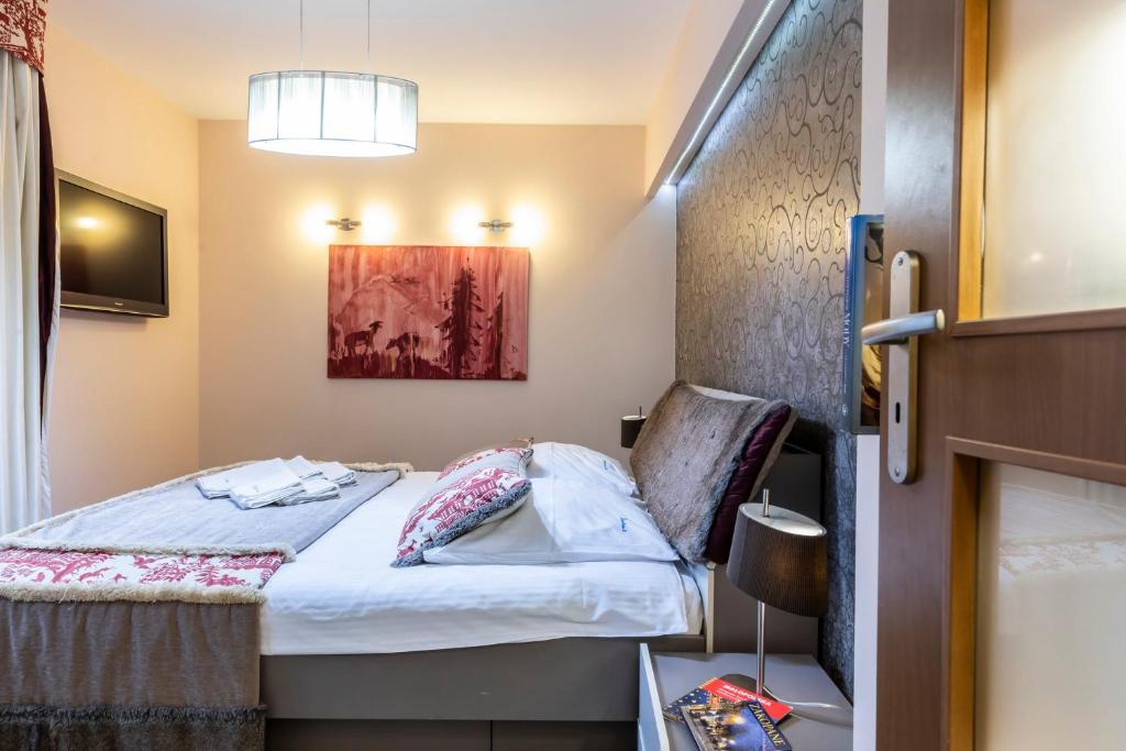Posteľ alebo postele v izbe v ubytovaní Prestige