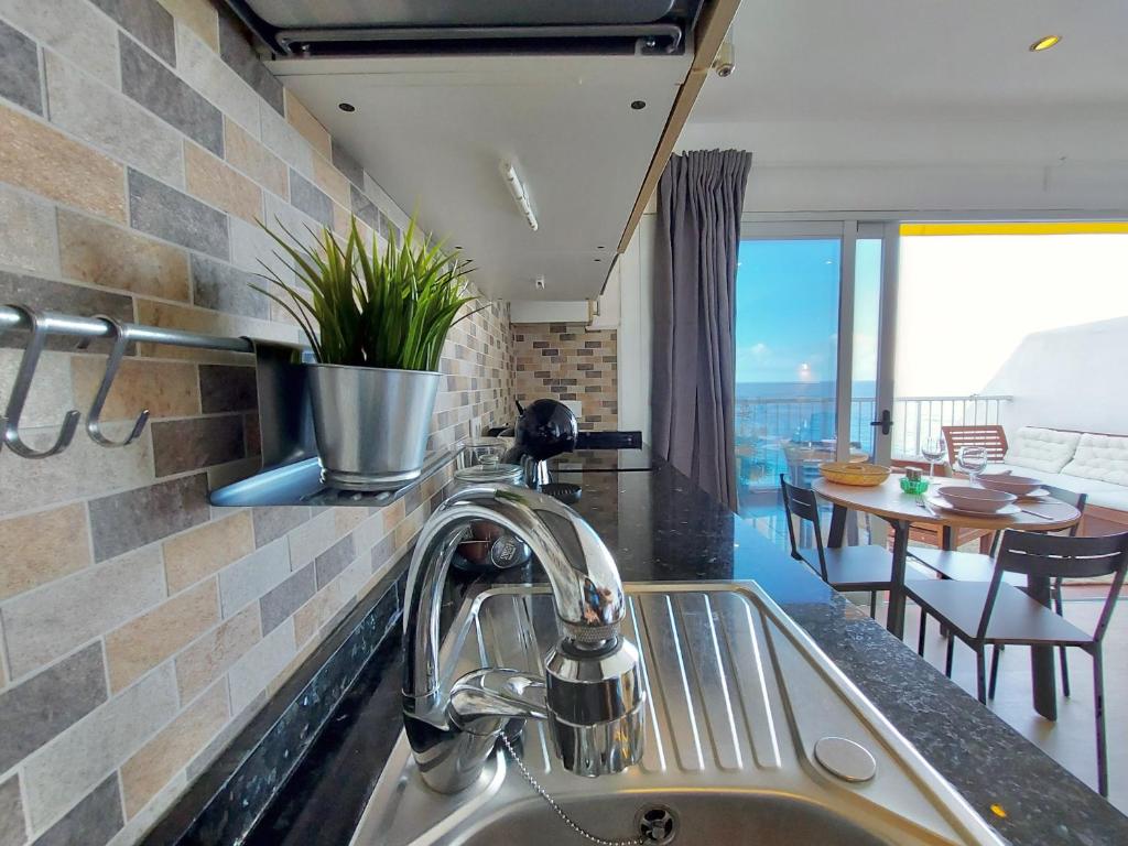 A kitchen or kitchenette at Coastview Terrace Studio by TOR