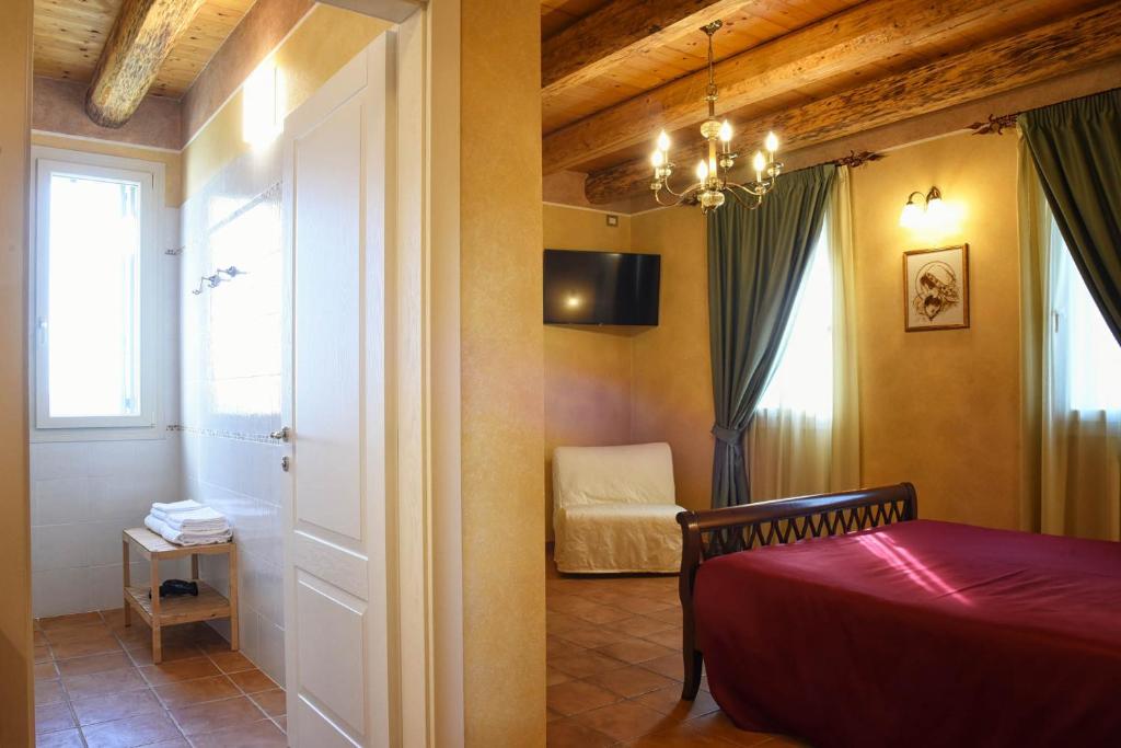 Letto o letti in una camera di Agriturismo Corte Benetti