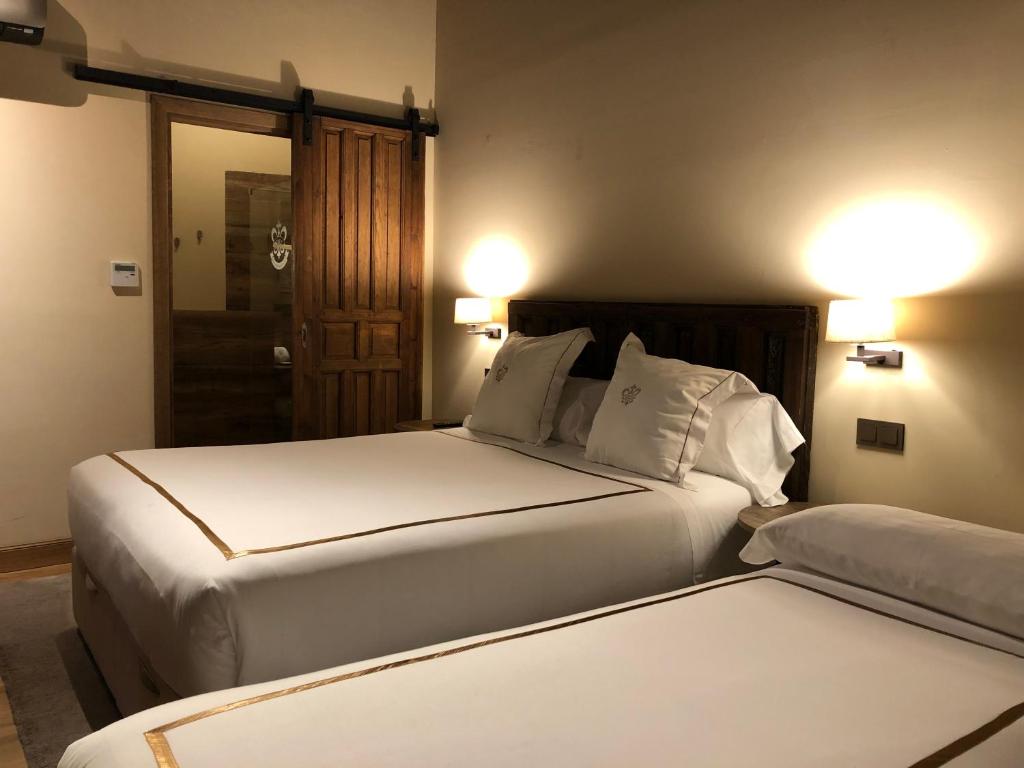 Postel nebo postele na pokoji v ubytování Hotel Boutique Casa del Comendador