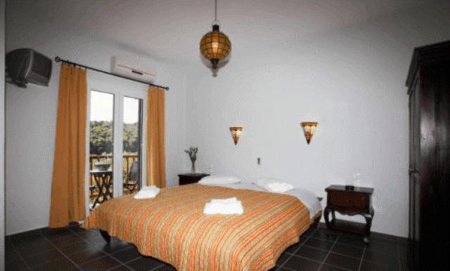 A bed or beds in a room at To Ktima tis Matinas