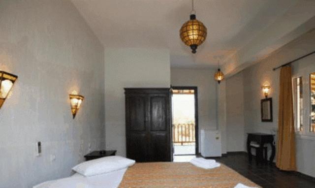 A bed or beds in a room at To Ktima tis Matinas