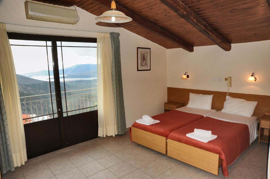 Postel nebo postele na pokoji v ubytování Castri Hotel