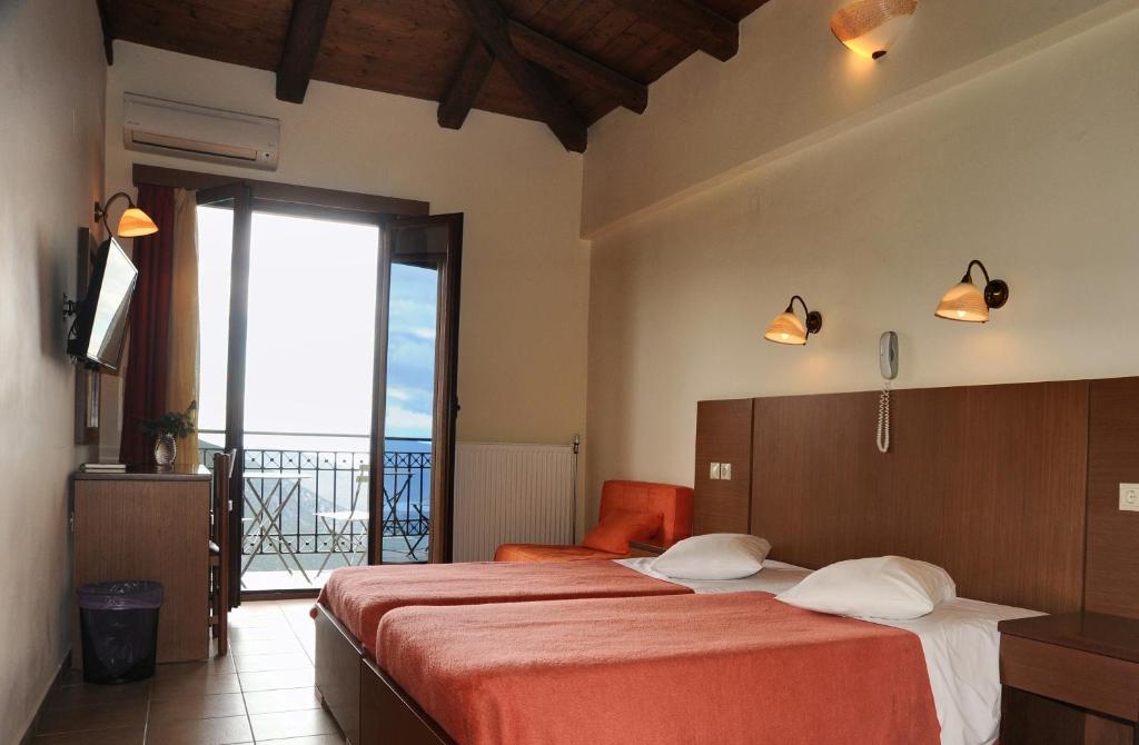 Postel nebo postele na pokoji v ubytování Castri Hotel