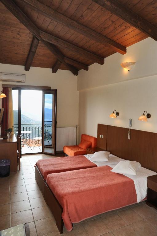 Postel nebo postele na pokoji v ubytování Castri Hotel