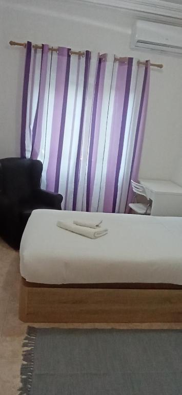 Postel nebo postele na pokoji v ubytování City apartment