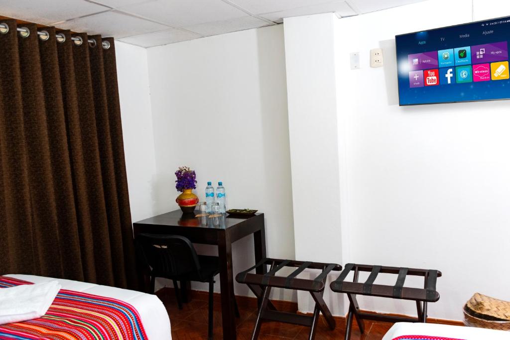 Postel nebo postele na pokoji v ubytování Peru Coca B&B Machupicchu