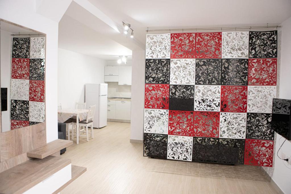 a room with a red and white tile wall at B&B da Mamma Anna in Matera