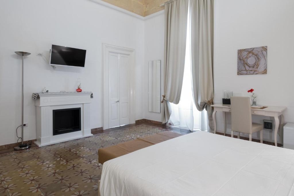 TV a/nebo společenská místnost v ubytování Ada Suites & Spa