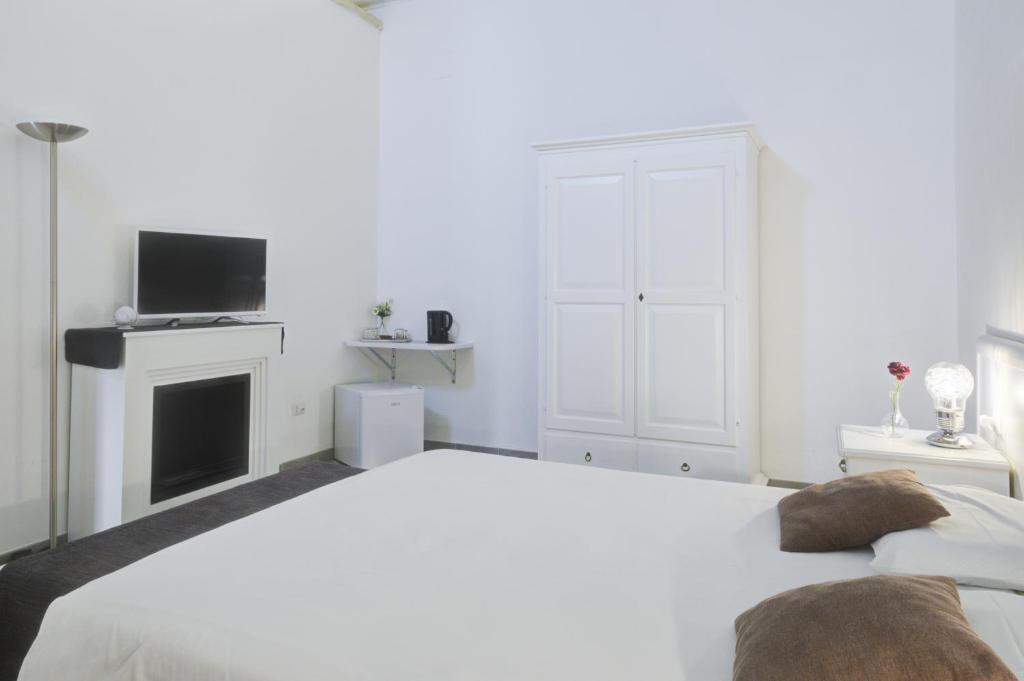 Postel nebo postele na pokoji v ubytování Ada Suites & Spa