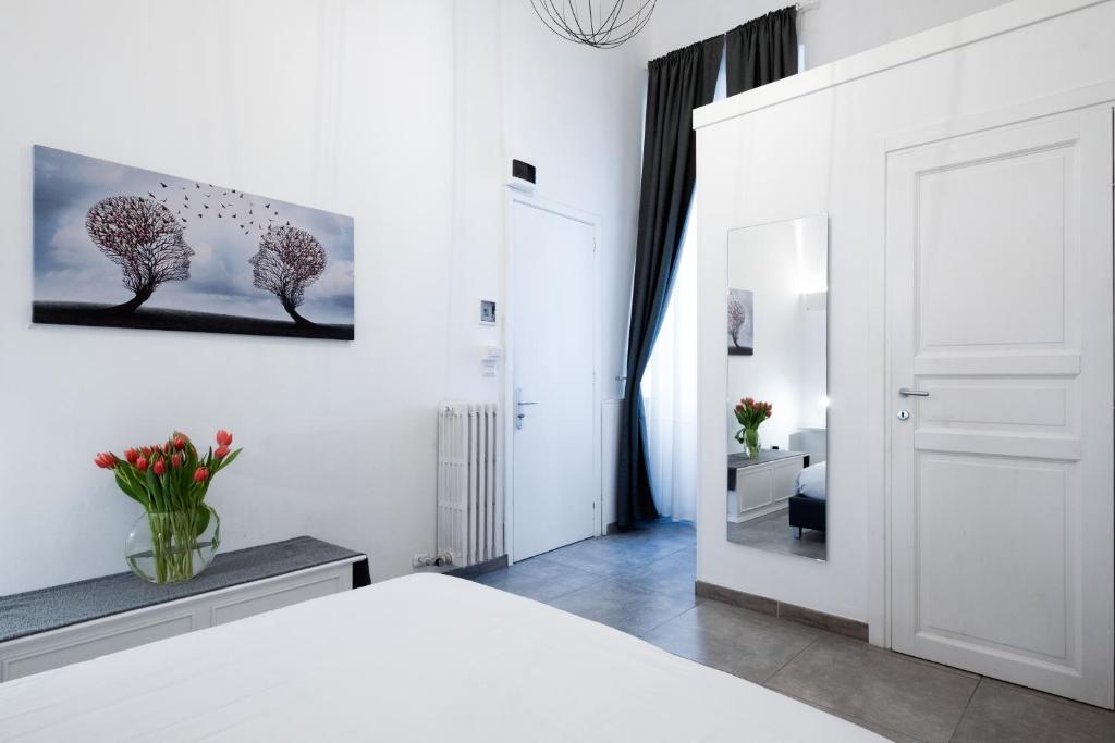 Postel nebo postele na pokoji v ubytování Ada Suites & Spa
