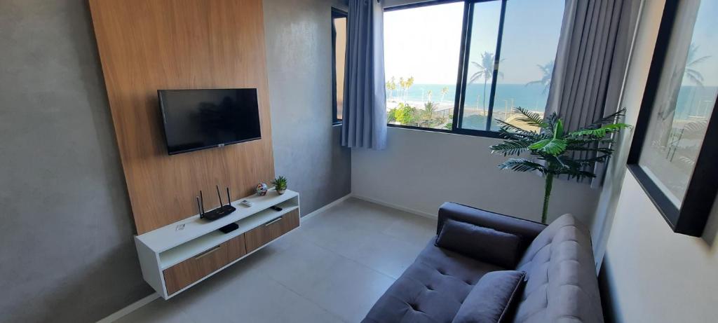 Et tv og/eller underholdning på Paraíso das águas, conforto e descanso com vista mar..