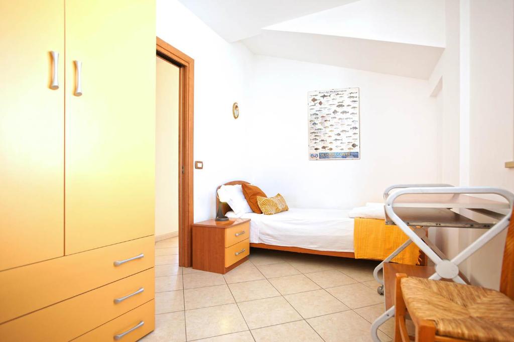 Posteľ alebo postele v izbe v ubytovaní CASA LUCA Appartamento al centro di Marzamemi vista mare con parcheggio privato