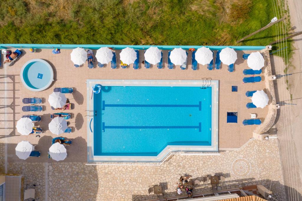 an overhead view of a swimming pool in a resort at Pothos Hotel Alykes in Alykes